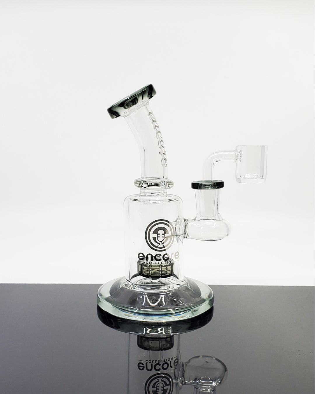  Encore Glass 6” Showerhead Banger Hanger with 11-hole perc, quartz nail, and 14mm female joint, providing smooth hits and efficient filtration in a compact design.